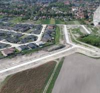 Aerial view of plots - housing in Veľký Meder with new buildings and surrounding landscape.