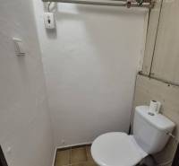 Bathroom with tiles in a studio apartment.