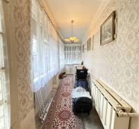A hallway in a family house with carpet and wallpaper, suitable for Strekov.