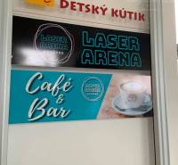 Children's Corner and Laser Arena in commercial premises. Advertising board of the café and bar.