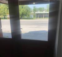 Exit from the warehouse and halls on Main Street in Chotín with a view of the surroundings.