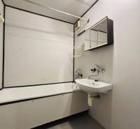 Bathroom with a shower and a mirrored cabinet in a 3-room apartment.