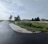 View of the road and grassy plots at Bučuháza in Šamorín. Plots - residential.