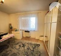 Cozy room in a family house with carpet and furniture, floor with wooden decor.