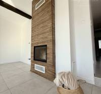 The interior of a family house with a wooden decor floor and modern design elements.