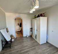 Interior of a 4-room apartment, laminate flooring, white furniture, pendant lights.