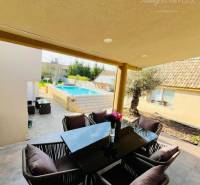 A family house with a garden seating area and a pool for relaxation and comfort.