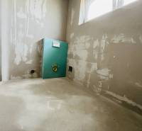 An unfinished room with drywall in a 3-room apartment, prepared for further modifications.