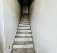 A narrow staircase with a tiled floor leads to the upper floor of a 3-room apartment.