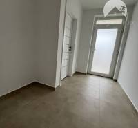 View of the entrance hallway in a family house with tiles in Topoľníky.