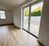 Interior of a family house with windows and a wooden decor floor.