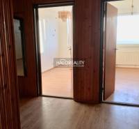 Interior of a 4-room apartment with a wooden decor floor and bright rooms.