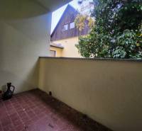 Balcony of a 2-room apartment with greenery, view of the surrounding architecture from Dolná Street.