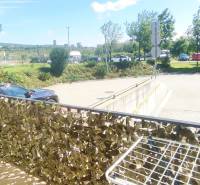 Balcony in Bratislava - Krasňany with a view of greenery and a parking lot, 1-room apartment.