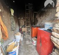 Storage space in a family house with old furniture and various storage needs.