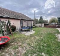 A family house on Pavla Street in Komárno with a grassy yard and a swing.