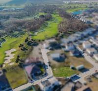 Plots in Hrubá Borša with a view of the golf course and residential houses.