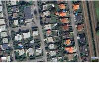 Aerial view of a family house on Košická Street in Trebišov with surrounding gardens.