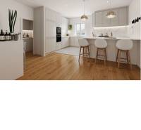 A kitchen in a family house with white cabinets and a wood-patterned floor.