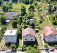 A family house at Dúbravská 58 in Prešov surrounded by a garden and vegetation.