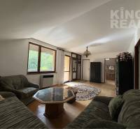 Living room in a family house with sofas, a carpet, and a coffee table.