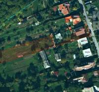 An aerial map from Dúbravská Street in Prešov shows the layout of plots near family houses.
