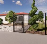A family house in Zemianska Olča with a landscaped garden and decorative trees behind the fence.