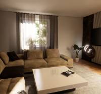 Living room in a family house with a comfortable sofa, television, and wooden decor flooring.
