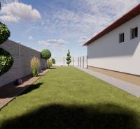 A family house in Zemianska Olča with a neatly maintained garden and decorative spiral greenery.