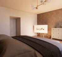 Bedroom in a family house with a wooden decor floor, a dresser, and a decorative wall.