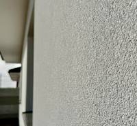 The facade of a family house in Topoľnica. Nearby is a window and a roof.