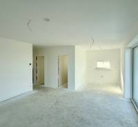 The interior of a family house with white walls, some with installation openings.