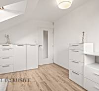 Interior of a family house with white furniture and a wooden decor floor.