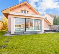 A family house in Dobrohošť with a spacious green garden and a glass terrace.