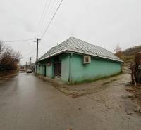 A street with a family house in Kolárovice, dreary autumn weather.