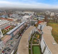 Aerial view of Petržalka in Bratislava with residential buildings and a playground.
