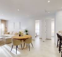 Living room in the Holiday Apartment with a comfortable sofa and a spacious dining table.