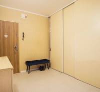 Entrance hallway in a 3-room apartment with sliding wardrobes and beige walls.