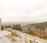 View of Trenčín from Saratovská Street, with a 3-room apartment and green hills.