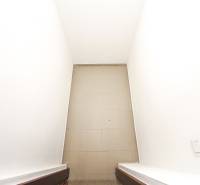 Narrow staircase with tiles in a 3-room apartment.