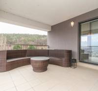 Outdoor terrace with rattan seating in a 3-room apartment on Saratovská in Trenčín.