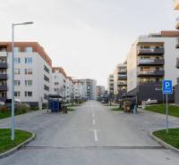 Apartment buildings on Liptovská Street in Trenčín with parking lots and greenery.