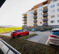 Apartment building on Liptovská Street in Trenčín with a parking lot and nearby nature.