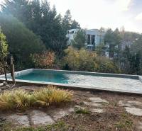 A garden with a pool surrounded by greenery in Bratislava - Old Town on Dolná Street.