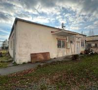 A building on Školská Street in Holíč, surrounded by greenery, suitable for commercial premises.
