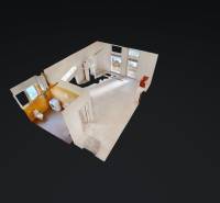 Interior of a commercial space with light walls, tiles, and sanitary equipment.