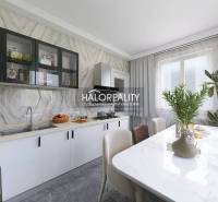 A kitchen in a family house with a stylish countertop and dining table.