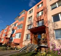 A prefab house on Ružová Street in Senica, colorful facades, sunny day, garden.