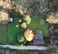 Aerial view of the Cottage in Štitáre, surrounded by greenery and trees.