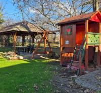 Wooden house and garden gazebos in the commercial premises on Park Street and Main Road, Veľké Ludince.